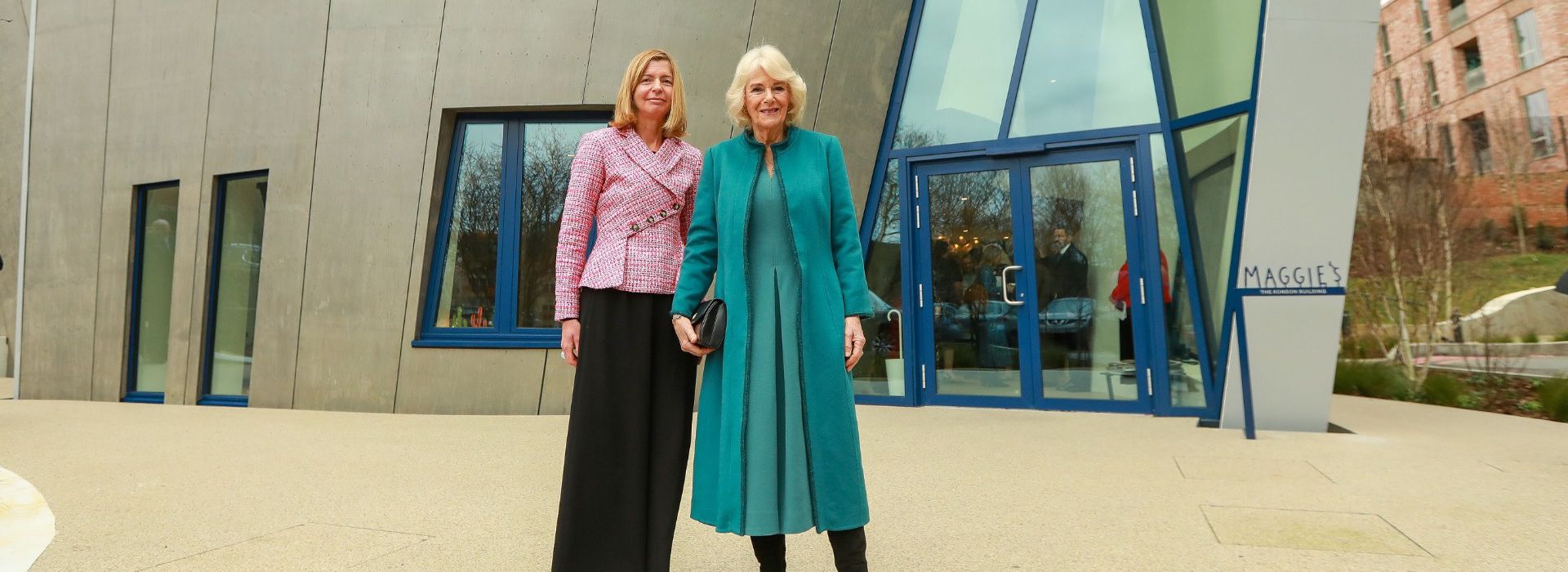 Landscape of HM The Queen and Dame Laura Lee in front of the new Royal Free Maggie's centre