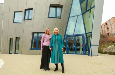 Landscape of HM The Queen and Dame Laura Lee in front of the new Royal Free Maggie's centre