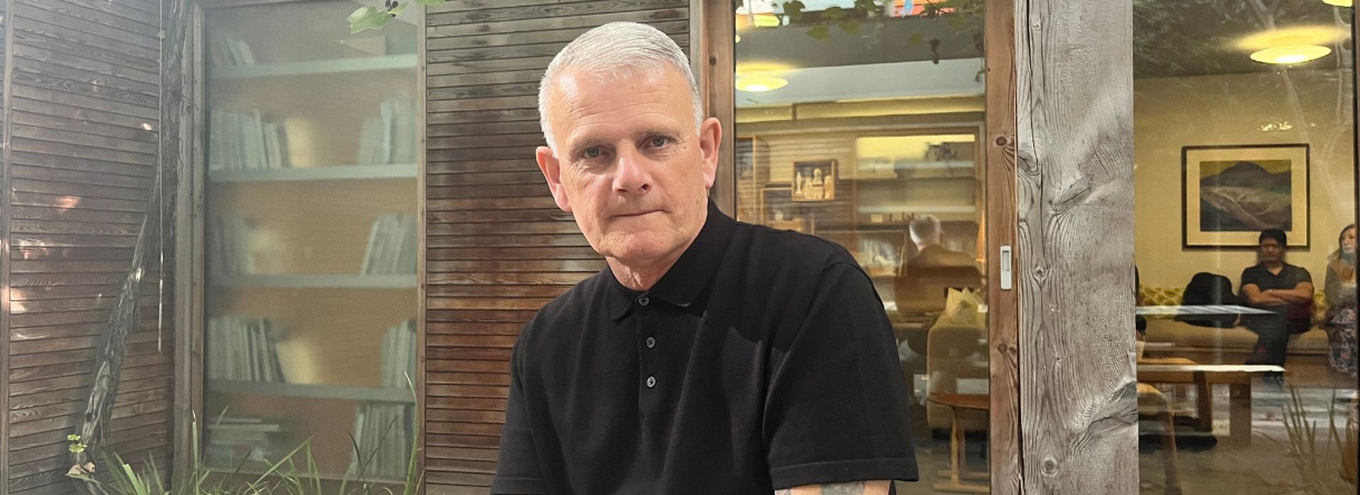 Portrait of Ray with Maggie's centre in background