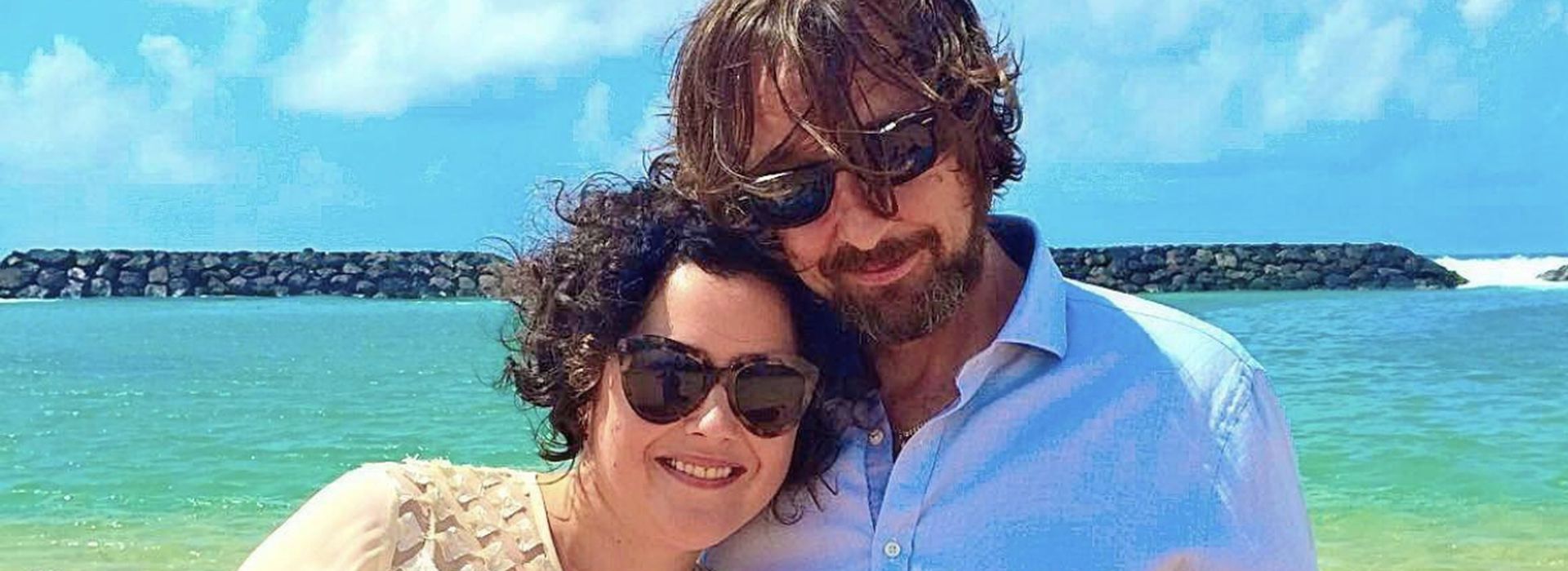 Beatrix and late husband Chris, smiling together by the sea