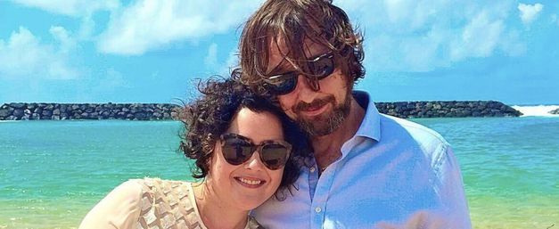 Beatrix and late husband Chris, smiling together by the sea