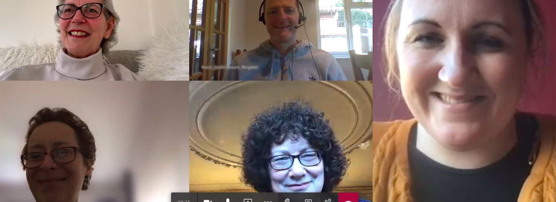 A screenshot of the online support group with thumbnails of smiling people's faces from their computer screens