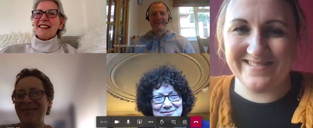 A screenshot of the online support group with thumbnails of smiling people's faces from their computer screens
