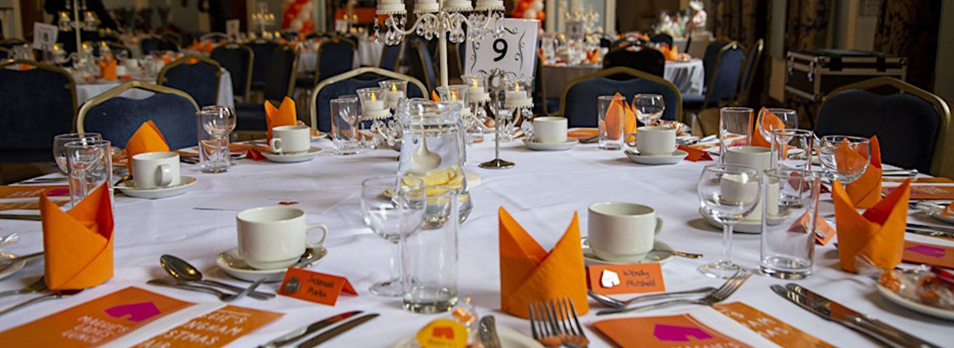 Lunch table settings with branded Maggie's materials