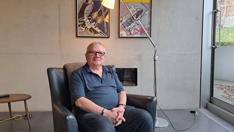 Tony sitting in an armchair in our Glasgow centre