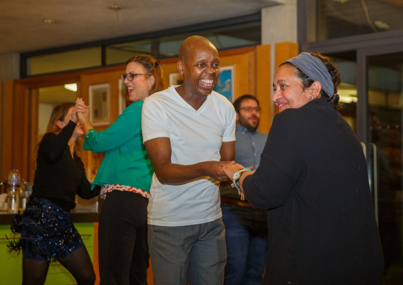 Centre visitors laughing in a salsa class at Maggie's West London