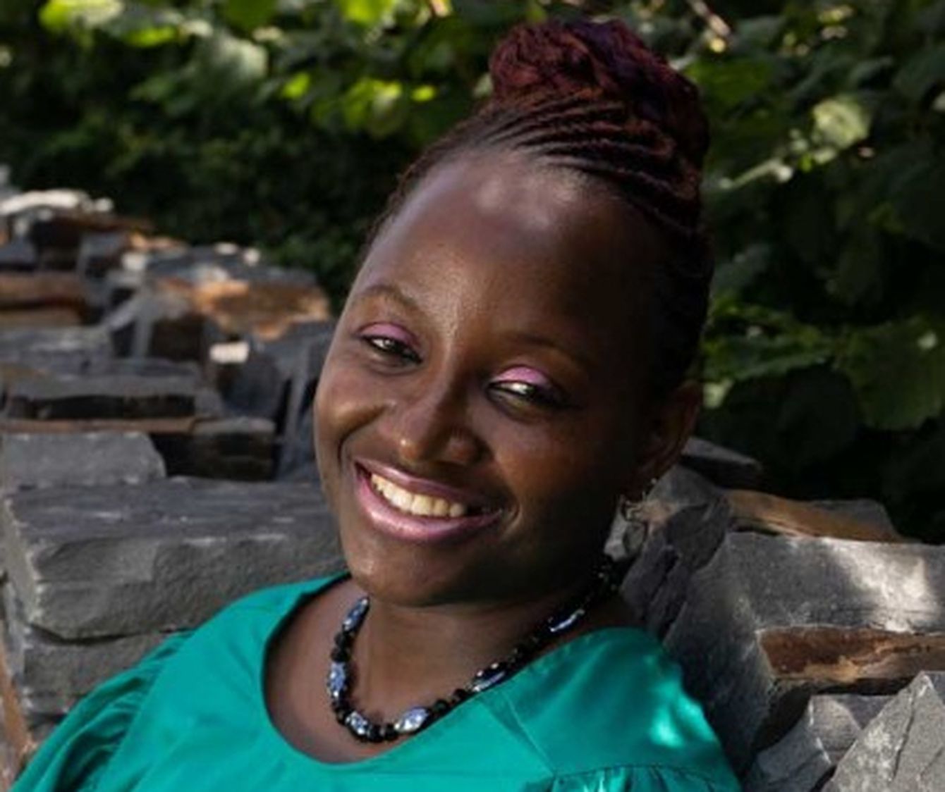 Headshot of Bami, smiling