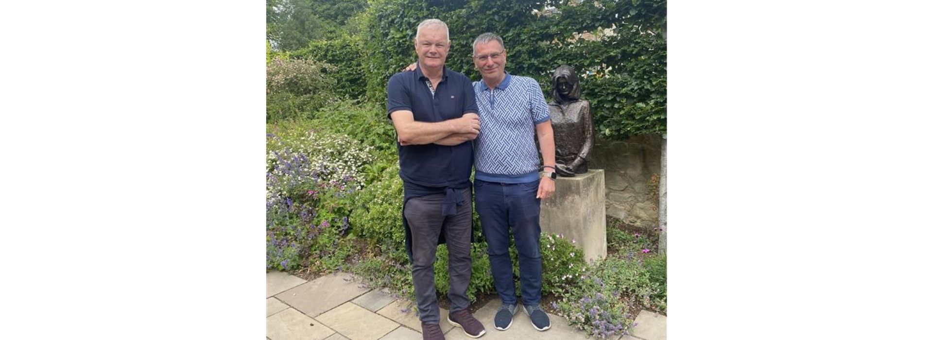 Edinburgh centre visitors Ian and Ken in front of statue of Maggie Keswick Jencks
