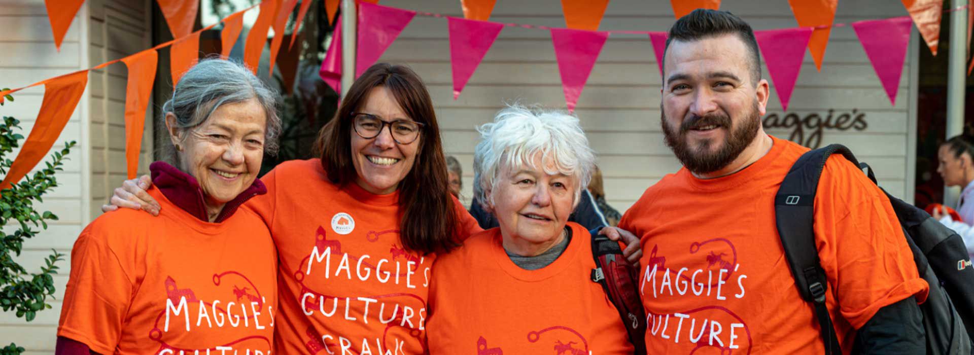 Martin and friends in Maggie's culture crawl t-shirts standing outside our centre in Manchester