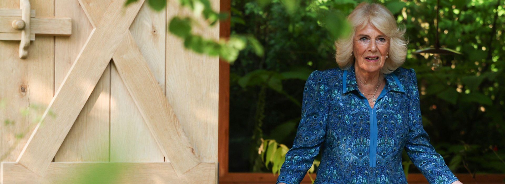 Queen Camilla looks out over garden at Chelsea Flower Show 2024