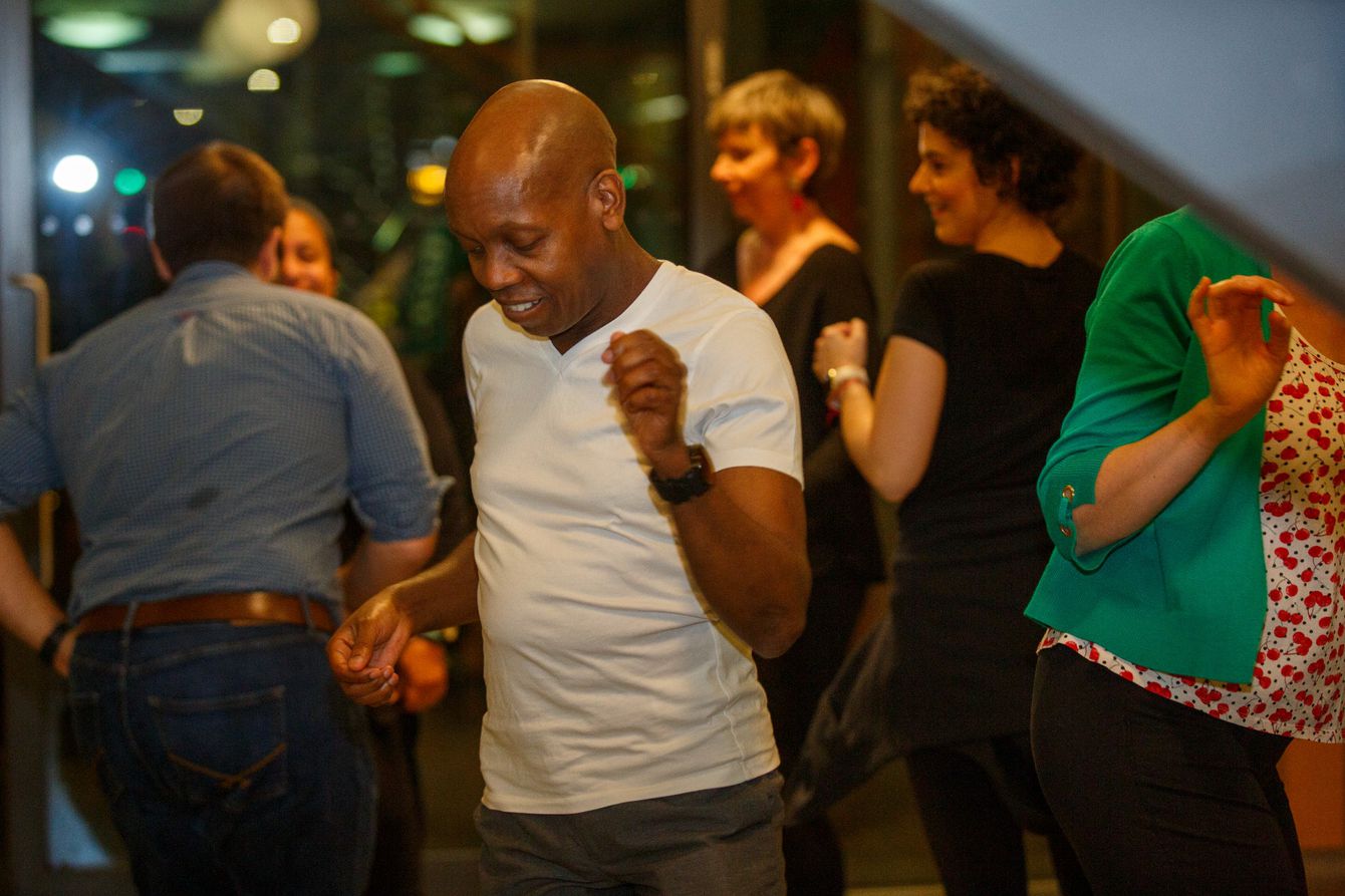 Visitors at Maggie's West London doing some freestyle dance during a salsa class