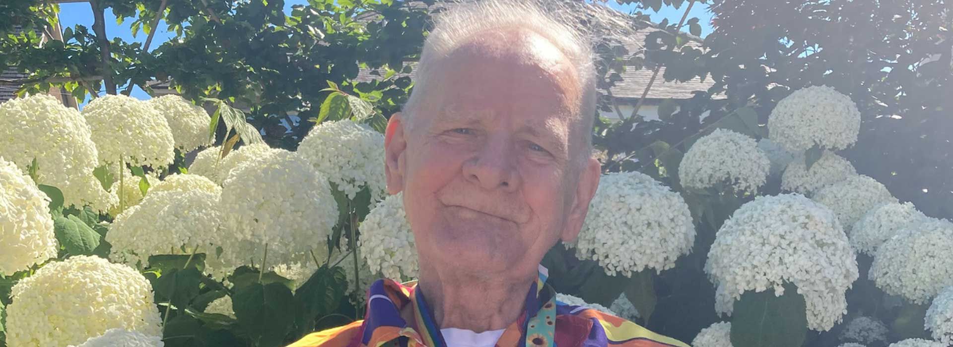 Eddie standing in a garden