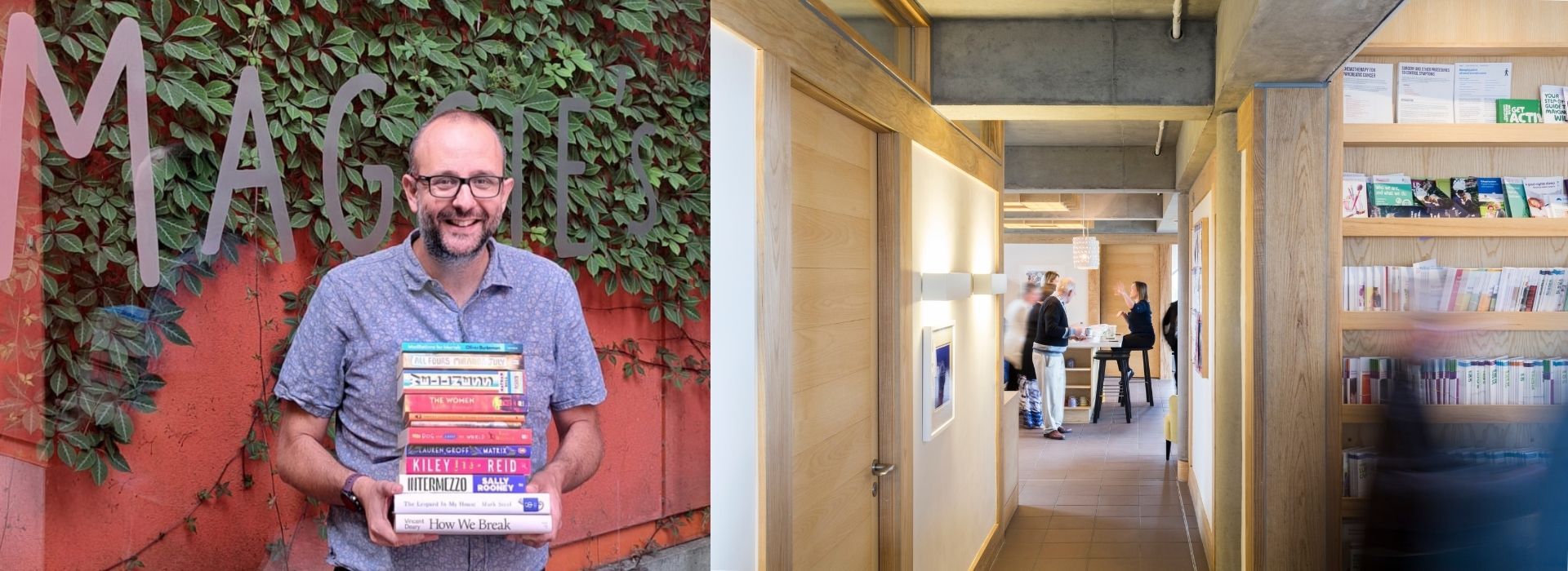 Maggie's representative holds books about cancer outside West London centre