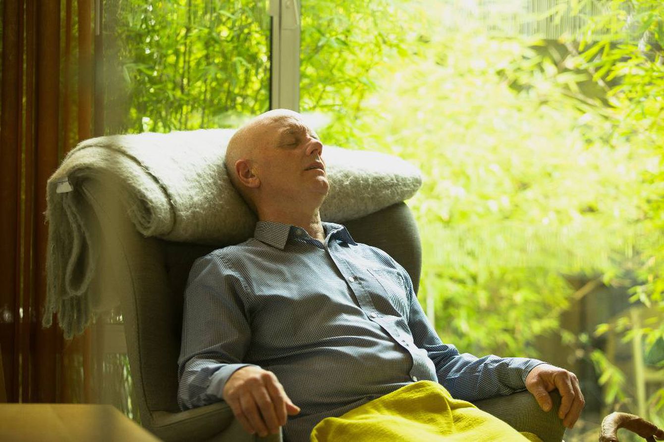 Man relaxing in armchair in our Lanarkshire centre